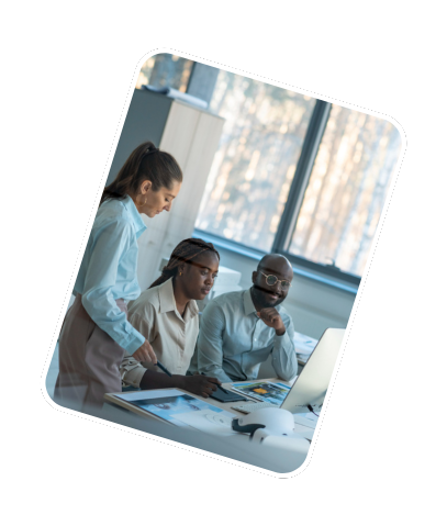 Colleagues discussing work together on a computer