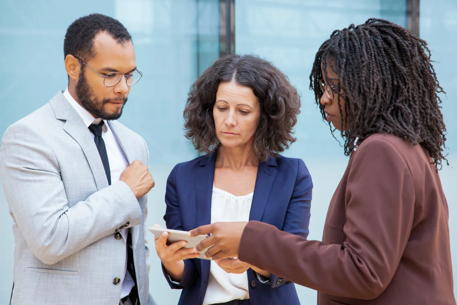 Colleagues reviewing information together on a tablet