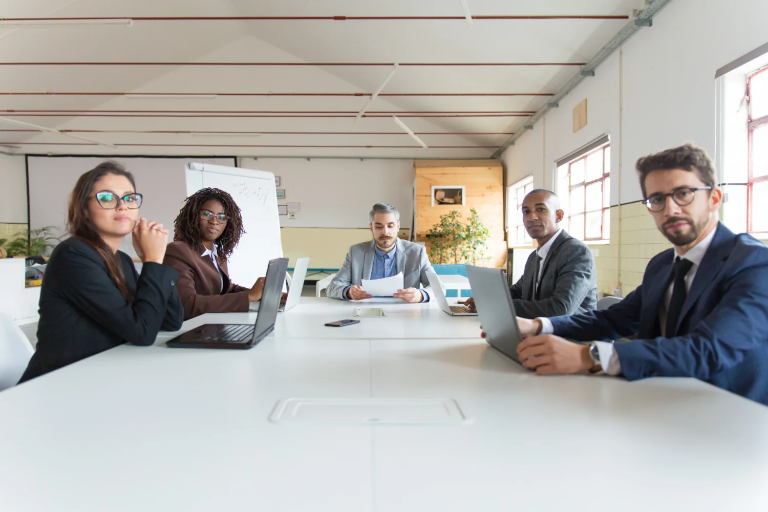 Colleagues meeting around a conference table