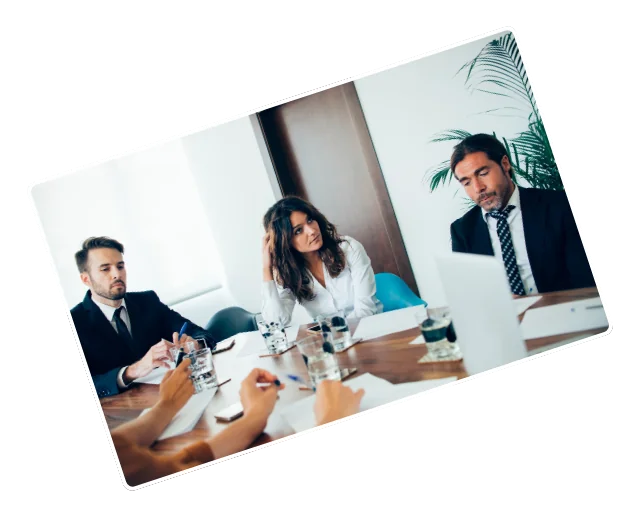 Professionals collaborating around a meeting table